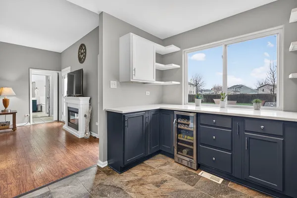 a kitchen with stainless steel appliances granite countertop a refrigerator sink and cabinets