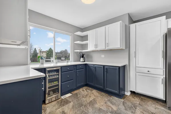 a kitchen with stainless steel appliances granite countertop a sink and cabinets