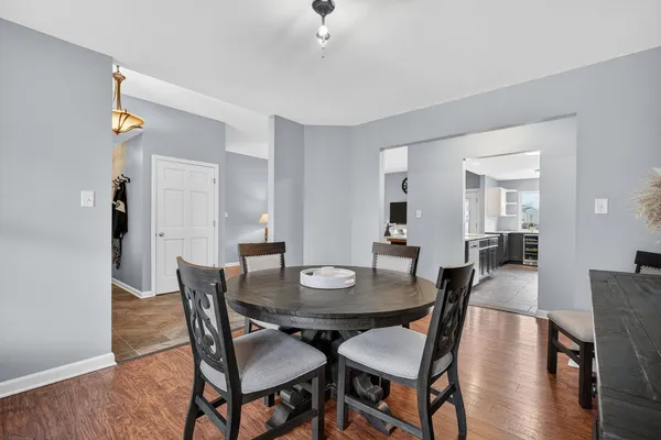 a view of a dining room with furniture and window