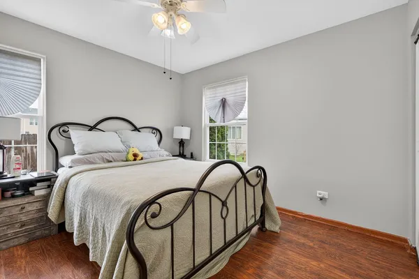 a view of a bedroom with a bed and a window