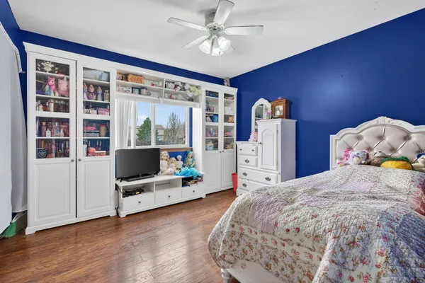 a bathroom with a toilet a sink and a mirror