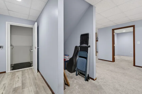 a kitchen with cabinets a refrigerator and a sink