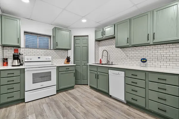 a view of bathroom with a toilet a sink and mirror