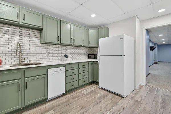 a kitchen with a stove and a refrigerator