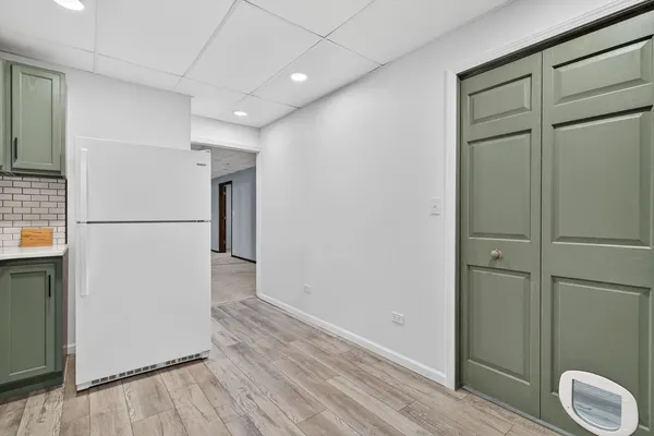 an empty room with a projector and screen