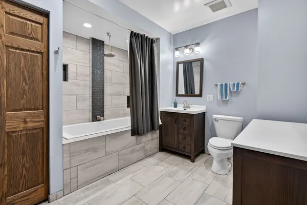 a balcony view with a seating space