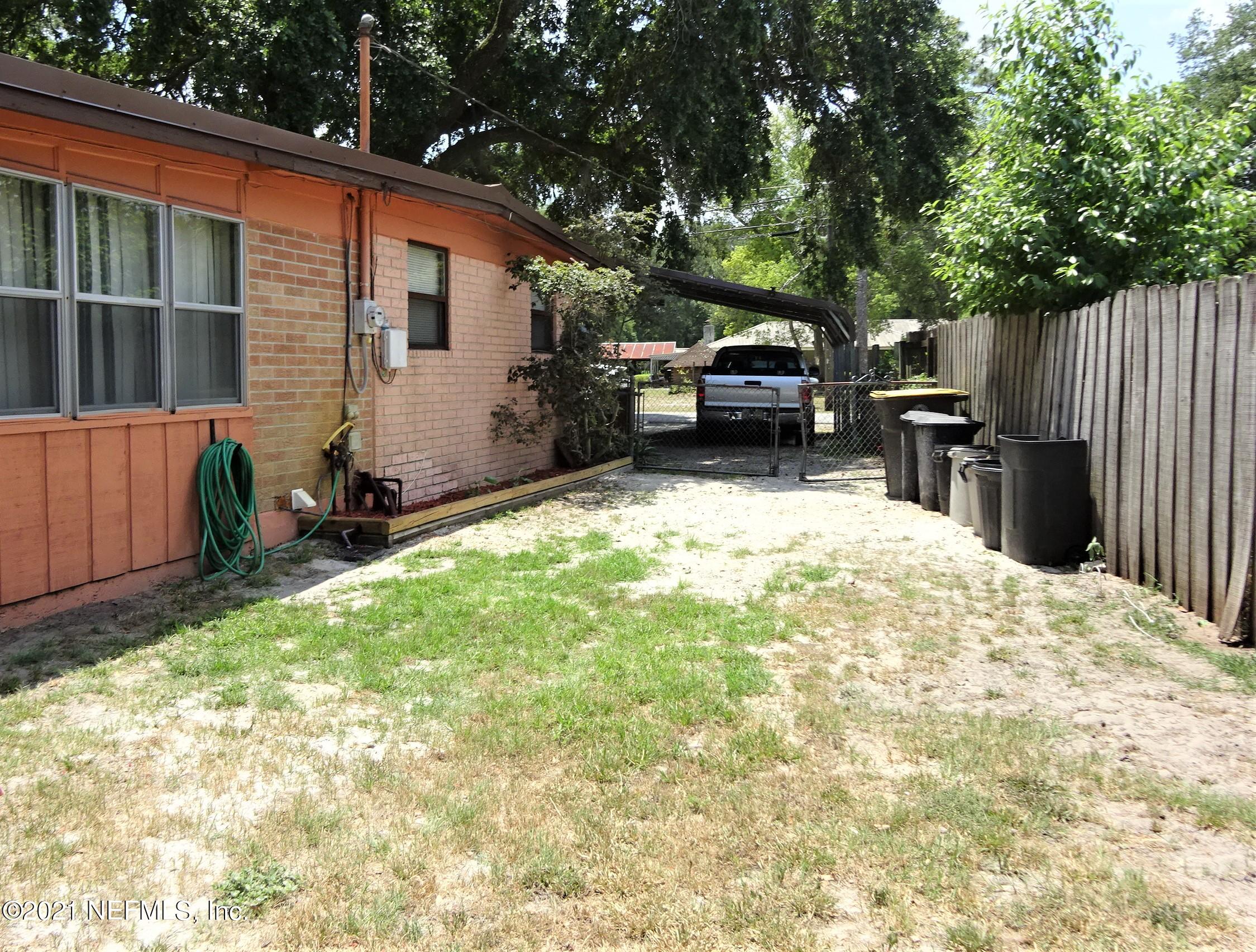 9347 Orme Road Jacksonville, FL 32220 - Photo 11 of 46 a view of a backyard with furniture