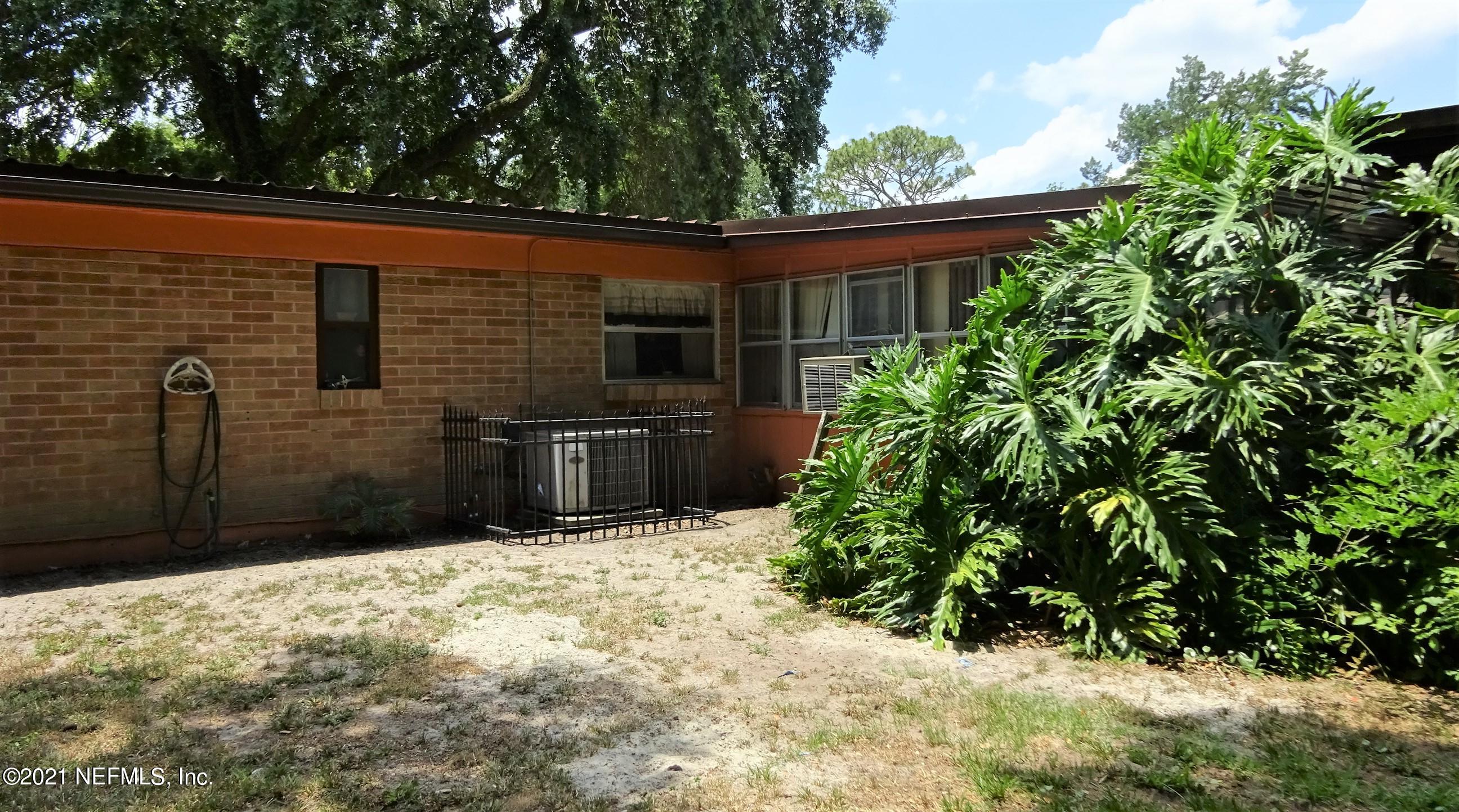 9347 Orme Road Jacksonville, FL 32220 - Photo 18 of 46 a backyard of a house with lots of green space