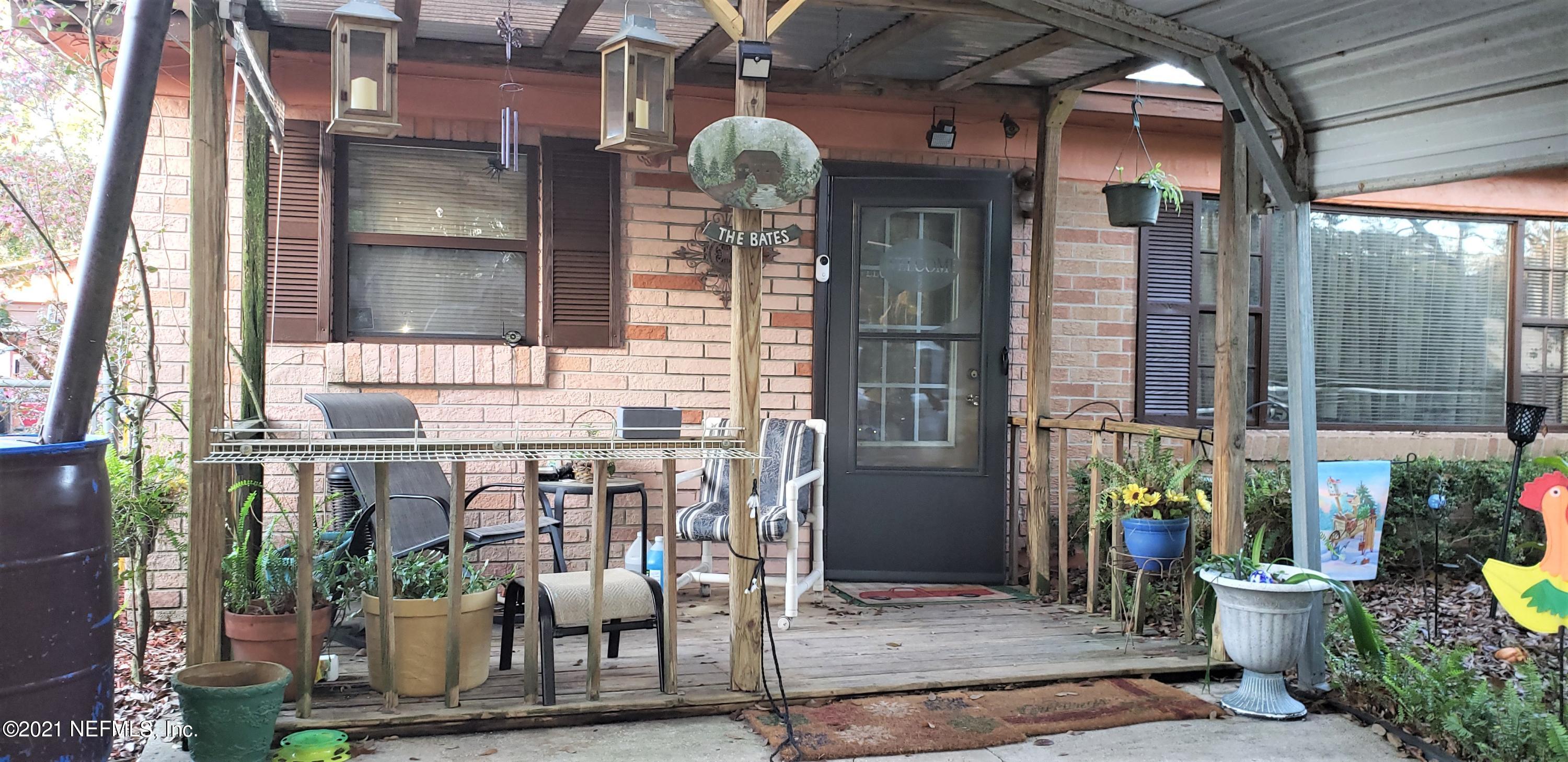 9347 Orme Road Jacksonville, FL 32220 - Photo 2 of 46 a front view of a house with outdoor seating