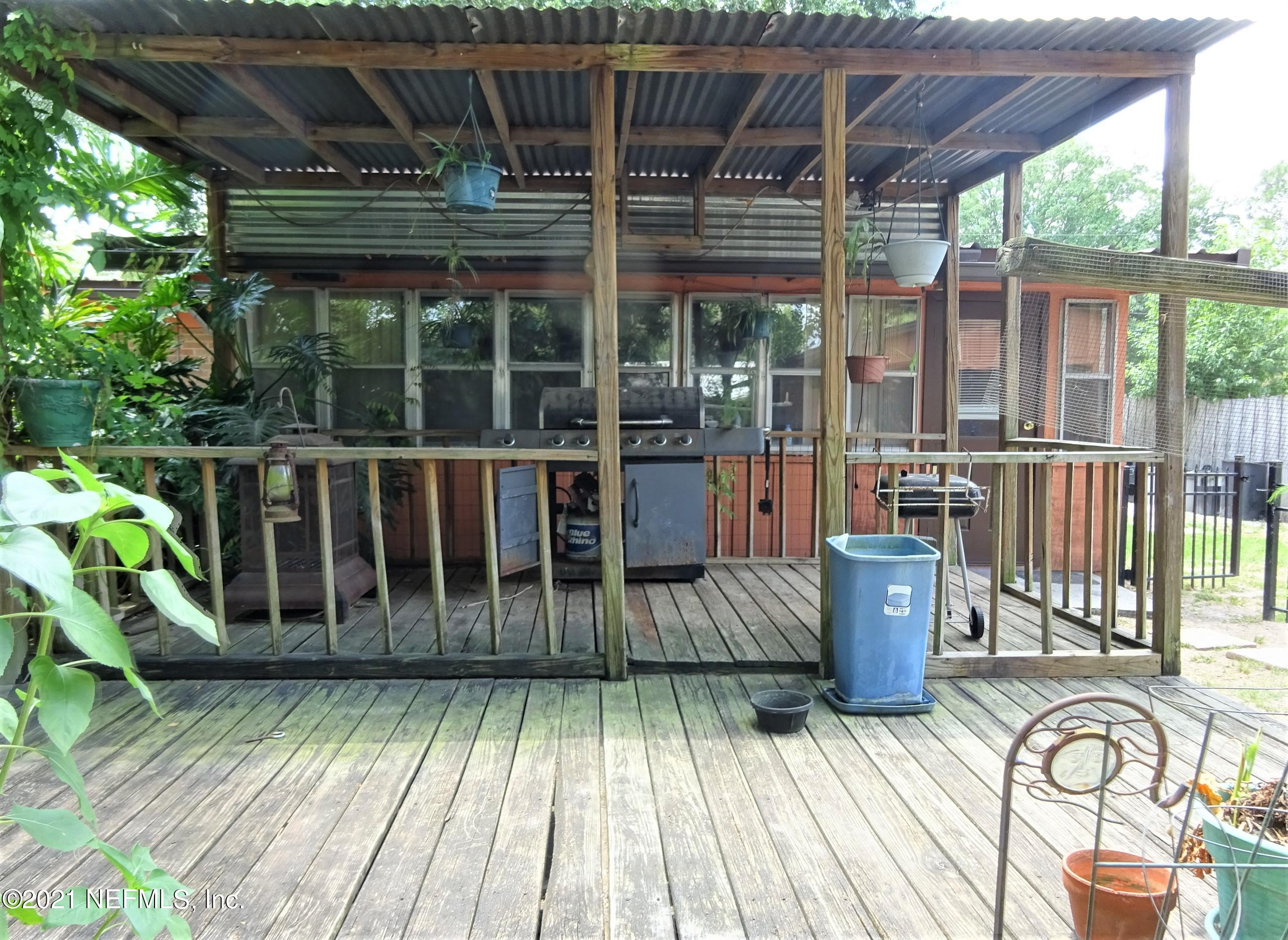9347 Orme Road Jacksonville, FL 32220 - Photo 21 of 46 a view of a deck with wooden floor and outdoor space