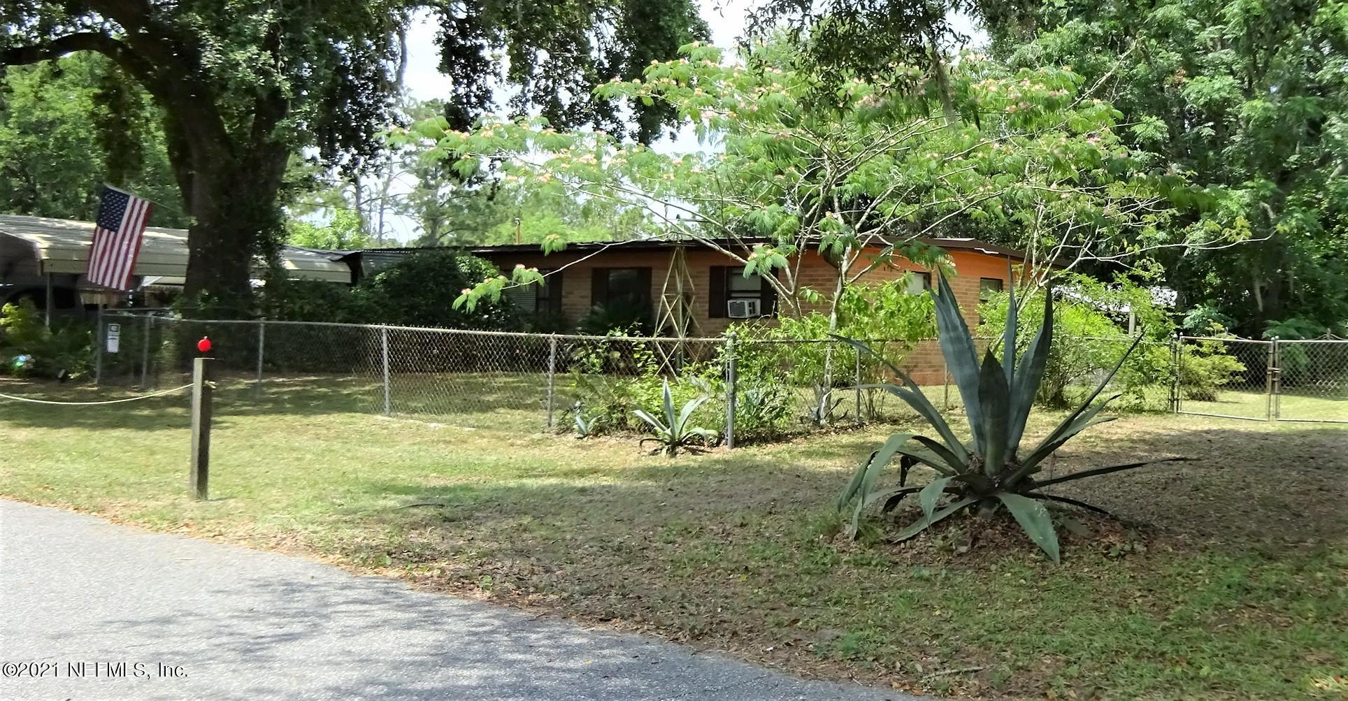 9347 Orme Road Jacksonville, FL 32220 - Photo 5 of 46 a backyard of a house with lots of green space