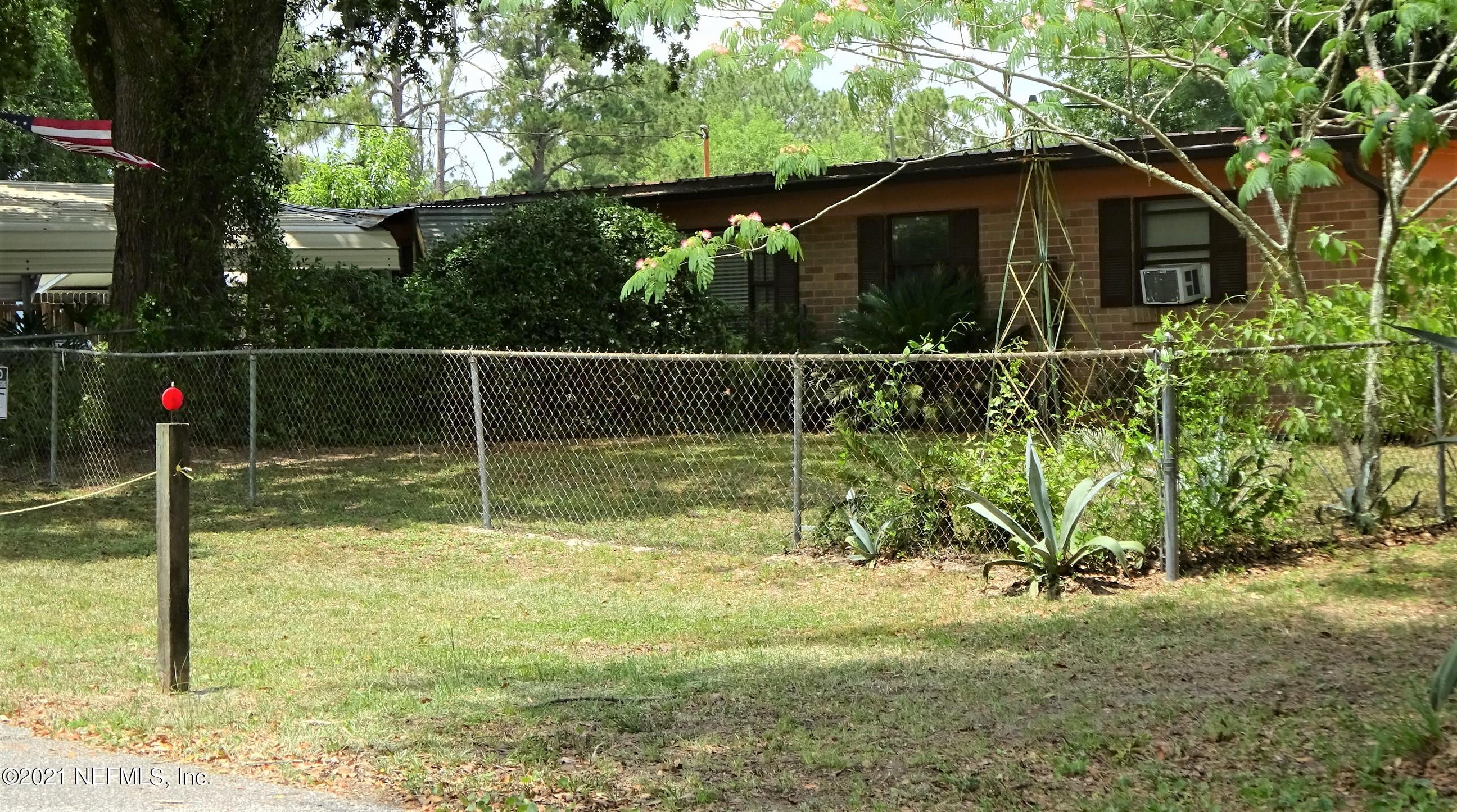 9347 Orme Road Jacksonville, FL 32220 - Photo 6 of 46 a backyard of a house with lots of green space