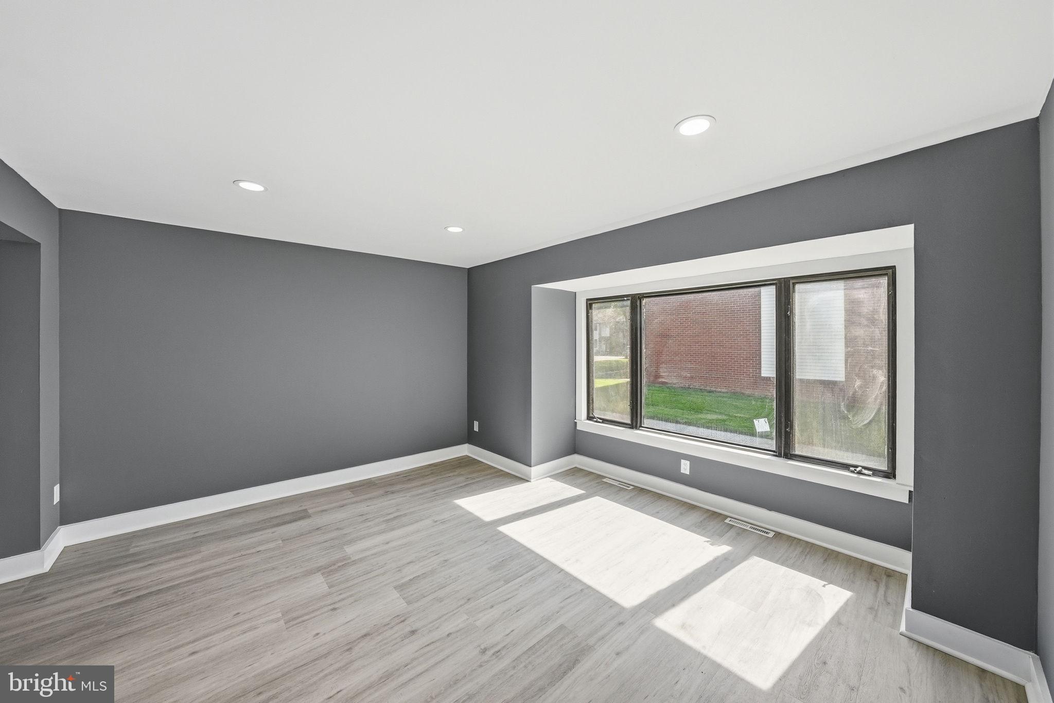 371 Bolton Road East Windsor, NJ 08520 - Photo 11 of 20 a view of an empty room with wooden floor and a window