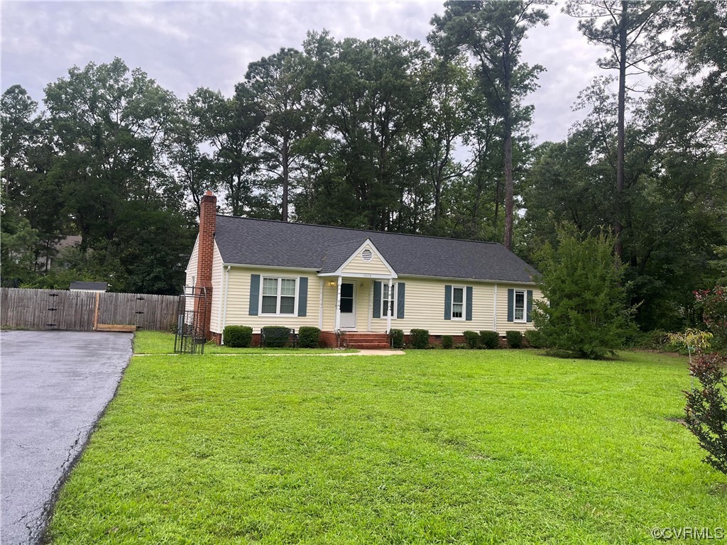 10770 Old Centralia Road Chester, VA 23831 - Photo 1 of 25 a view of a house with a yard and large trees