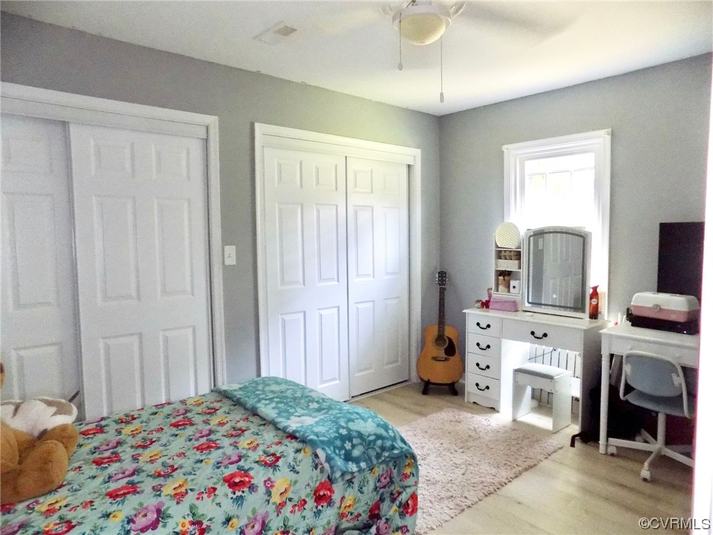10770 Old Centralia Road Chester, VA 23831 - Photo 13 of 25 a bedroom with a bed and a fireplace