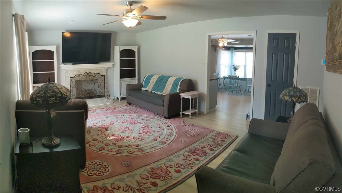 10770 Old Centralia Road Chester, VA 23831 - Photo 19 of 25 a living room with furniture and a fireplace
