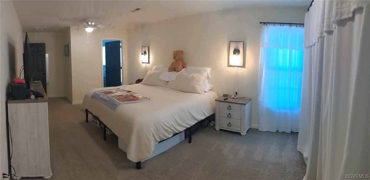 10770 Old Centralia Road Chester, VA 23831 - Photo 20 of 25 a bedroom with a bed and a table