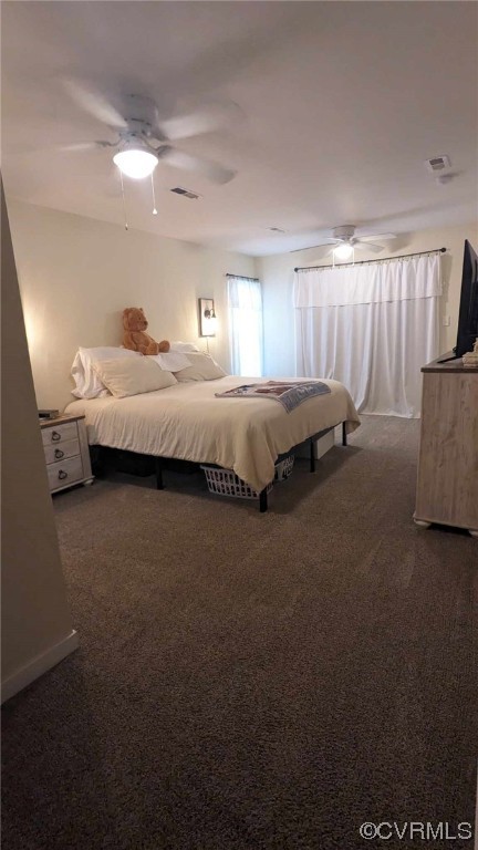 10770 Old Centralia Road Chester, VA 23831 - Photo 22 of 25 a spacious bedroom with a bed and large windows