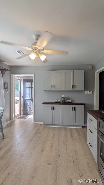 10770 Old Centralia Road Chester, VA 23831 - Photo 8 of 25 a kitchen with cabinets wooden floor and a view of living room