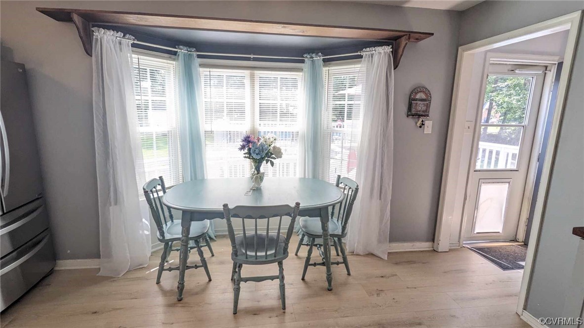 10770 Old Centralia Road Chester, VA 23831 - Photo 9 of 25 a view of a dining room with furniture and a window
