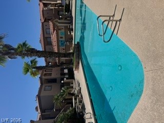 1851 Hillpointe Road, Unit 1412 Henderson, NV 89074 - Photo 3 of 3 Relax poolside in this refreshing outdoor oasis, surrounded by mature palm trees and stylish architecture.