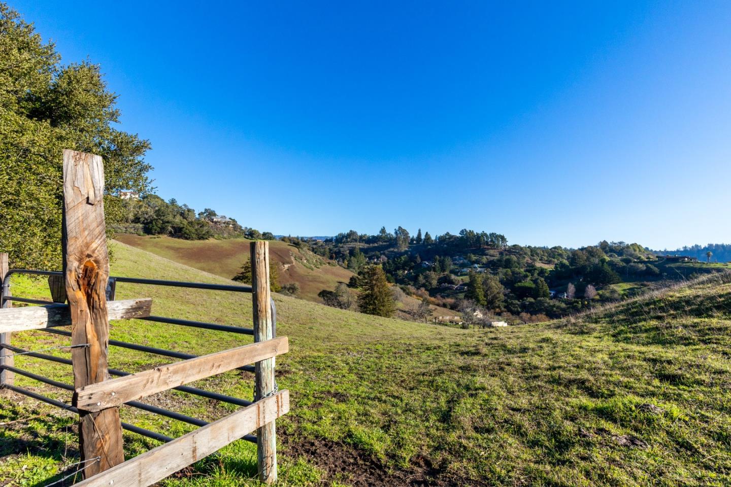 a view of a wooden fence with a mountain view