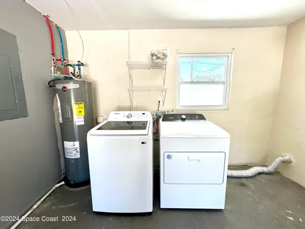 a utility room with dryer and washer