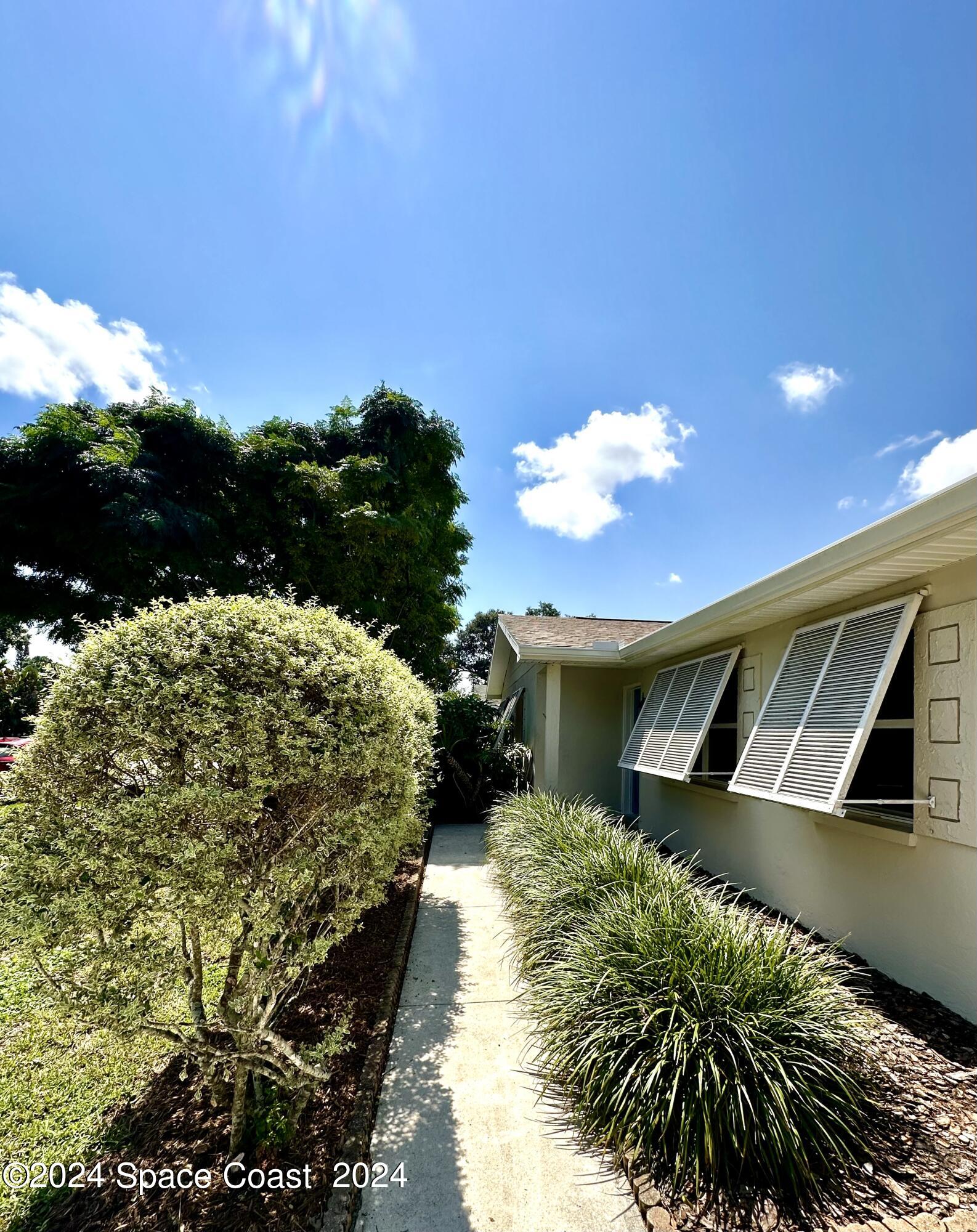 245 Monaco Road Melbourne, FL 32904 - Photo 2 of 16 Front walk way