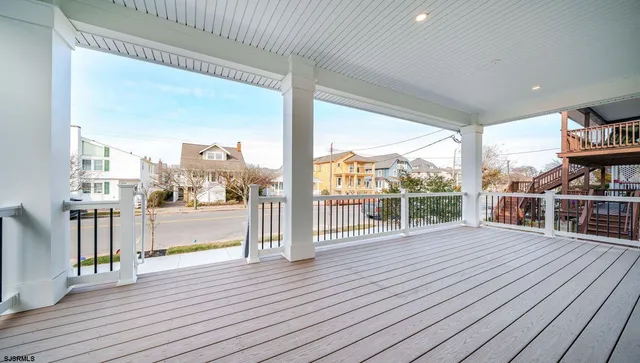 a view of a balcony with wooden floor