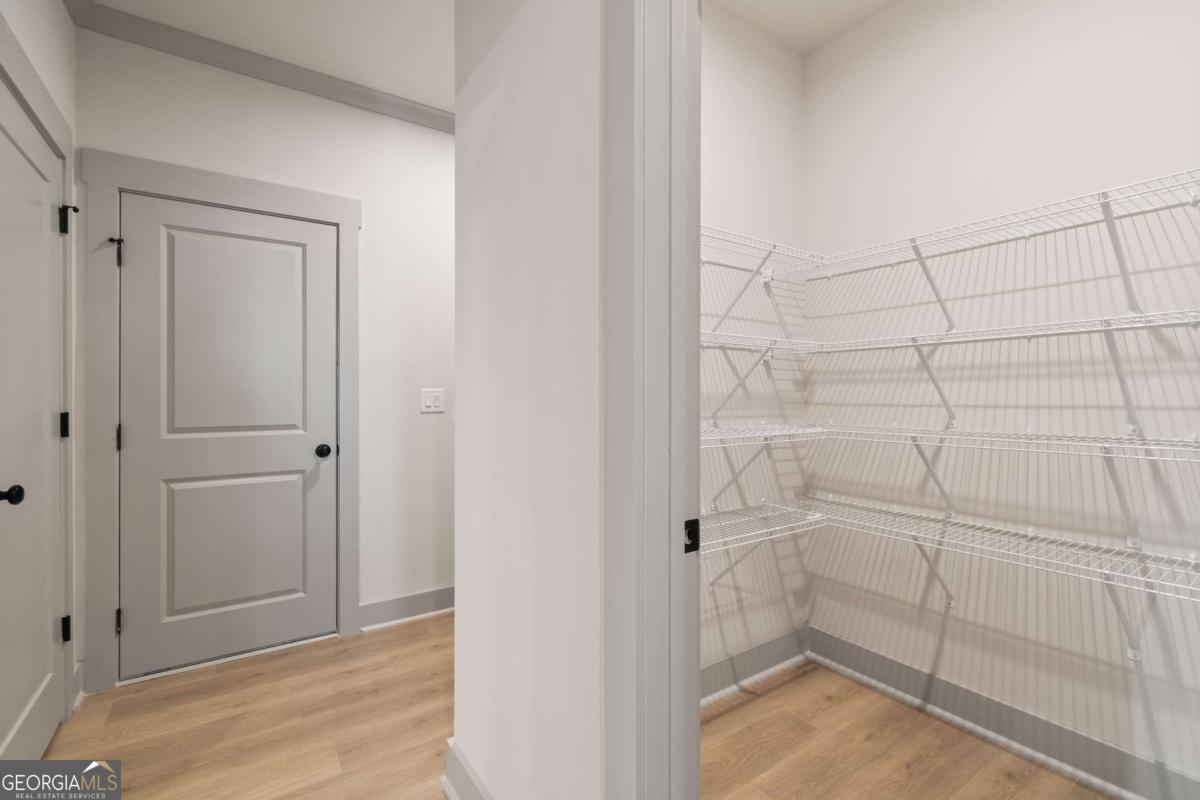 147 Henley Street, Unit 63 Canton, GA 30114 - Photo 19 of 36 a view of walk in closet