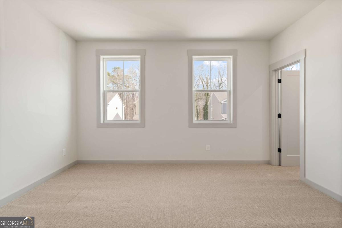 147 Henley Street, Unit 63 Canton, GA 30114 - Photo 24 of 36 an empty room with windows and closet