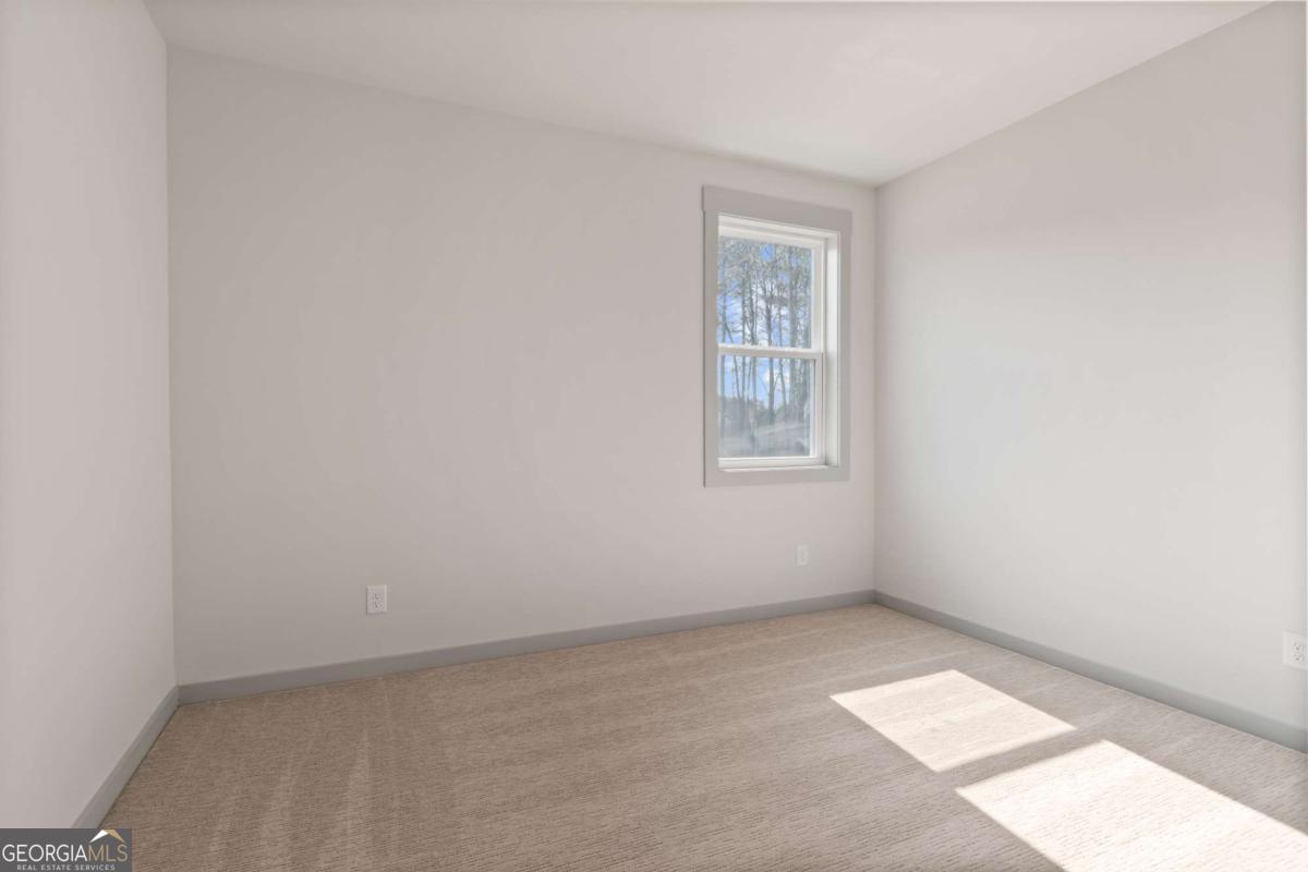 147 Henley Street, Unit 63 Canton, GA 30114 - Photo 29 of 36 an empty room with windows