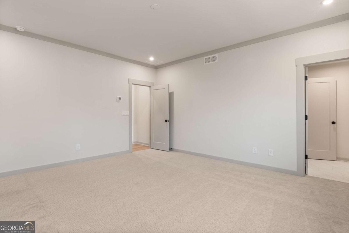 147 Henley Street, Unit 63 Canton, GA 30114 - Photo 31 of 36 a view of an empty room