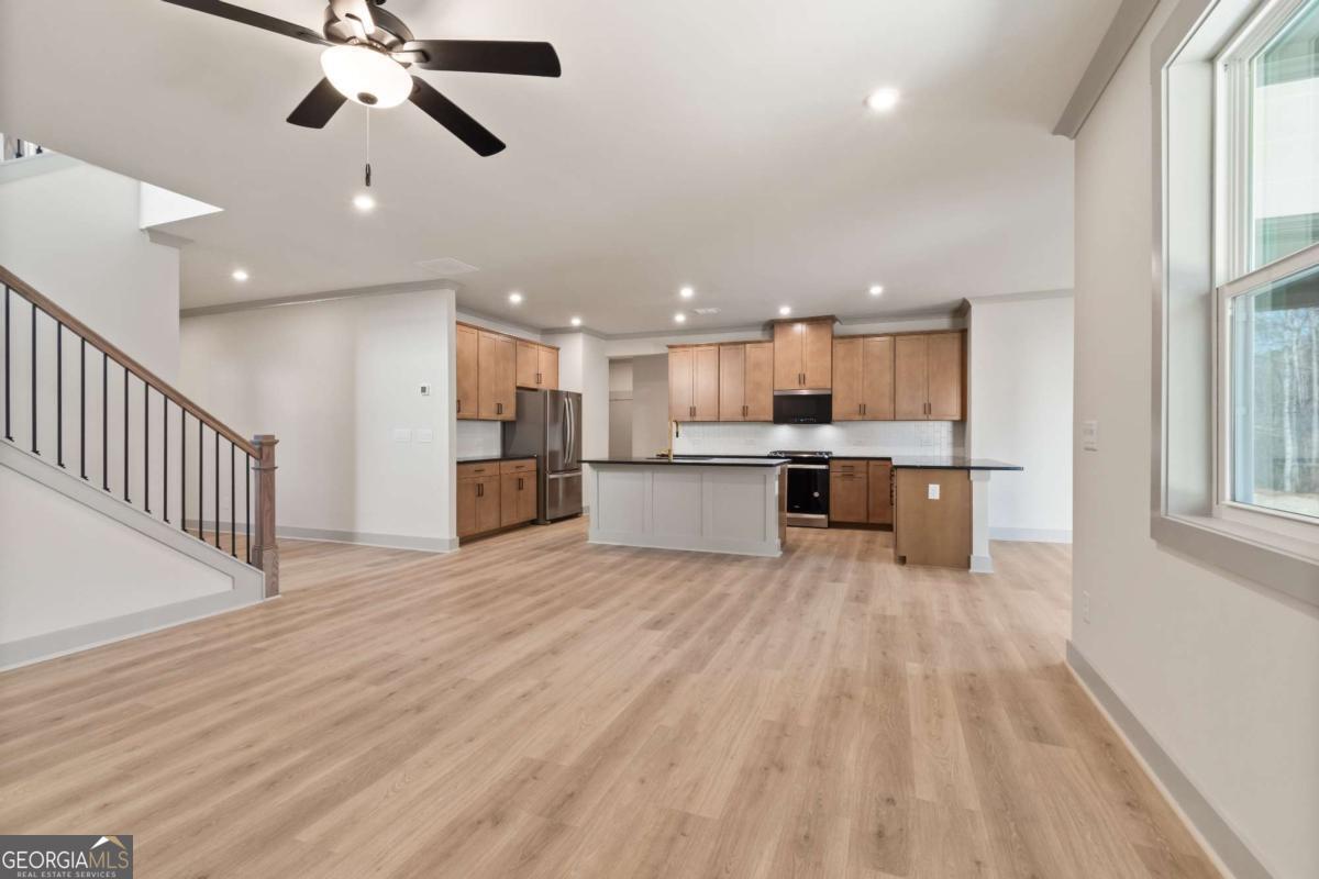 147 Henley Street, Unit 63 Canton, GA 30114 - Photo 9 of 36 a view of a kitchen with a sink and an oven