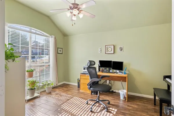 a lobby with furniture and a mirror