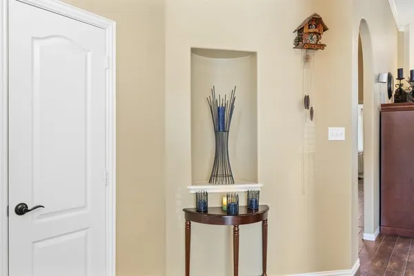 a view of a livingroom with workspace and a window