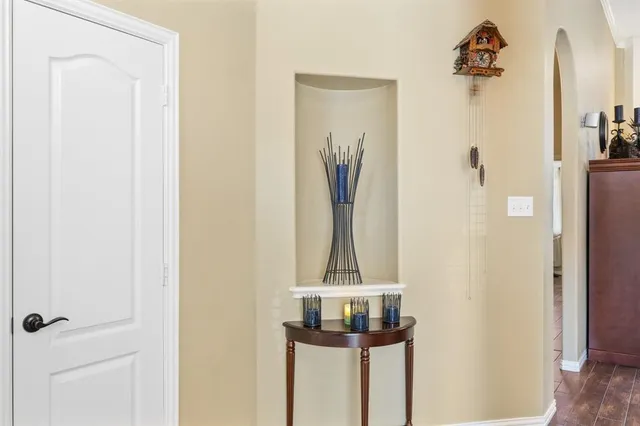 a view of a livingroom with workspace and a window