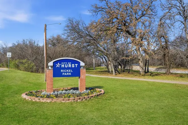 a huge green field with lots of trees