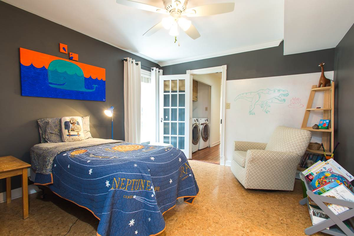 1715 Six Gables Road Durham, NC 27712 - Photo 16 of 25 What kid wouldn't absolutely LOVE this cool bedroom. Cork floors, white board wall for drawing, awesome color, direct access to the Jack-n-Jill bath...AND...wait for it...(next photo please)... Bedroom 3