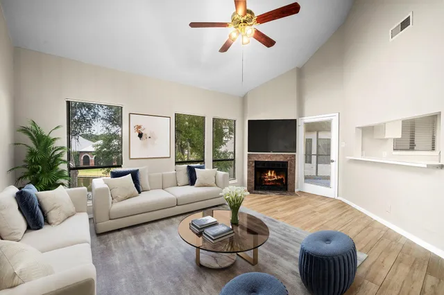 a living room with furniture and a fireplace