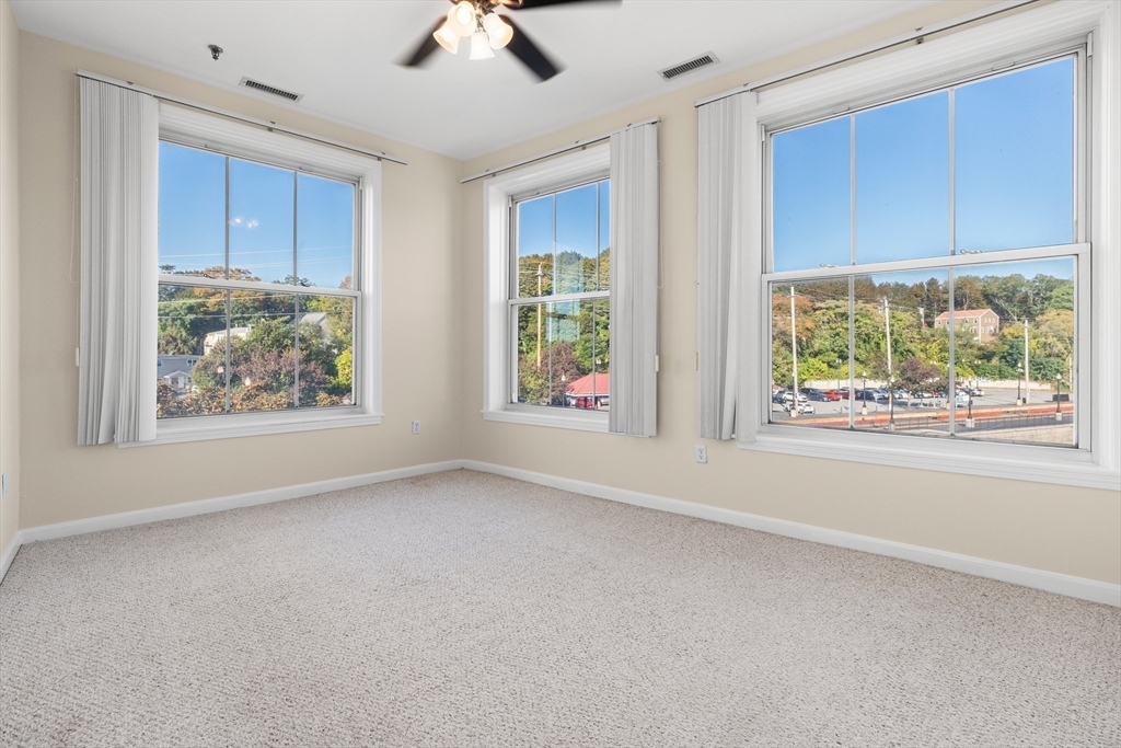 80 Wingate Street, Unit 4C Haverhill, MA 01832 - Photo 12 of 27 a view of an empty room with window and cabinet