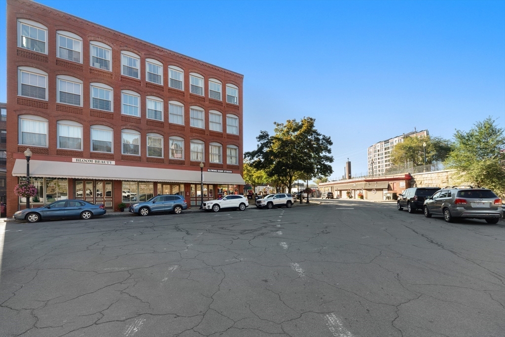 80 Wingate Street, Unit 4C Haverhill, MA 01832 - Photo 19 of 27 a view of a cars park in front of a building