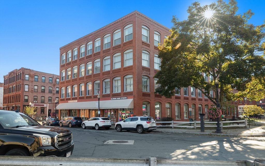 80 Wingate Street, Unit 4C Haverhill, MA 01832 - Photo 26 of 27 a city street lined with buildings and cars