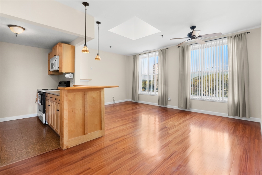 80 Wingate Street, Unit 4C Haverhill, MA 01832 - Photo 3 of 27 a view of a kitchen with wooden floor and a sink