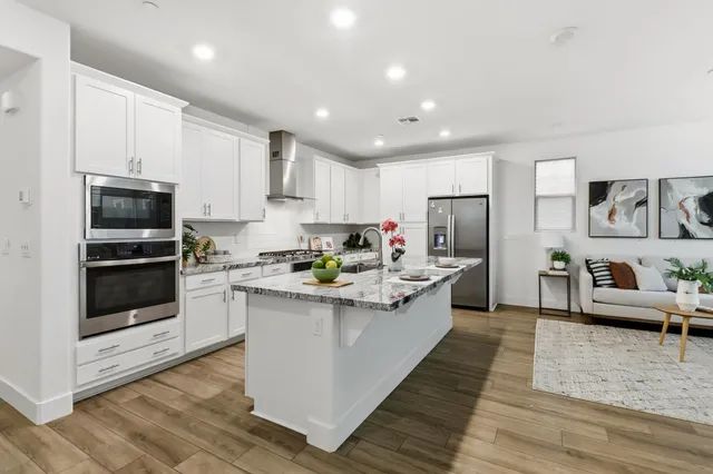 a kitchen with a stove and a microwave