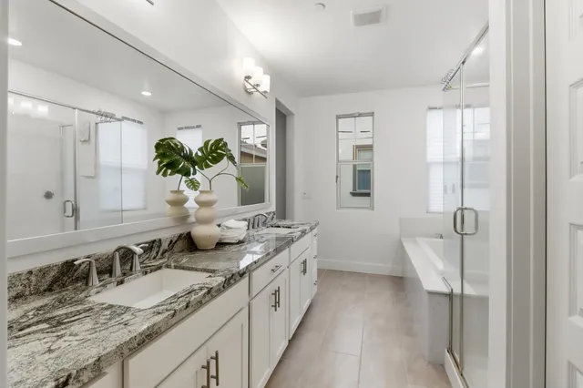 a bathroom with a bathtub and a shower