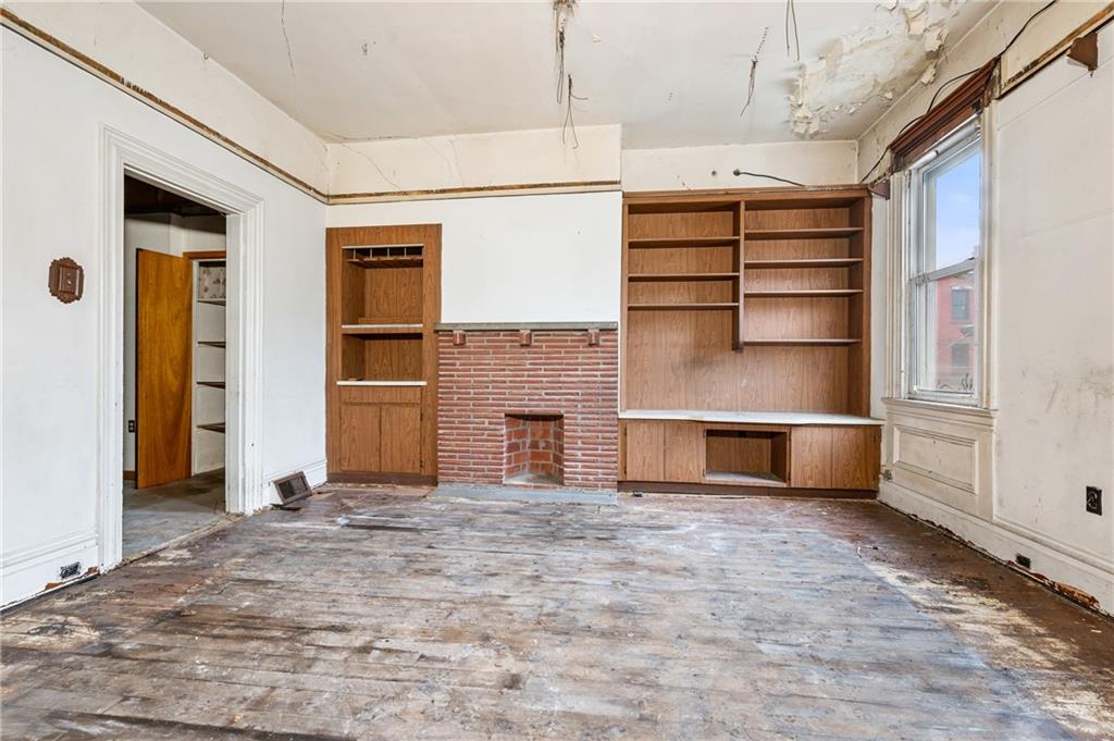 1234 High Street Pittsburgh, PA 15212 - Photo 13 of 27 a view of an empty room with a fireplace