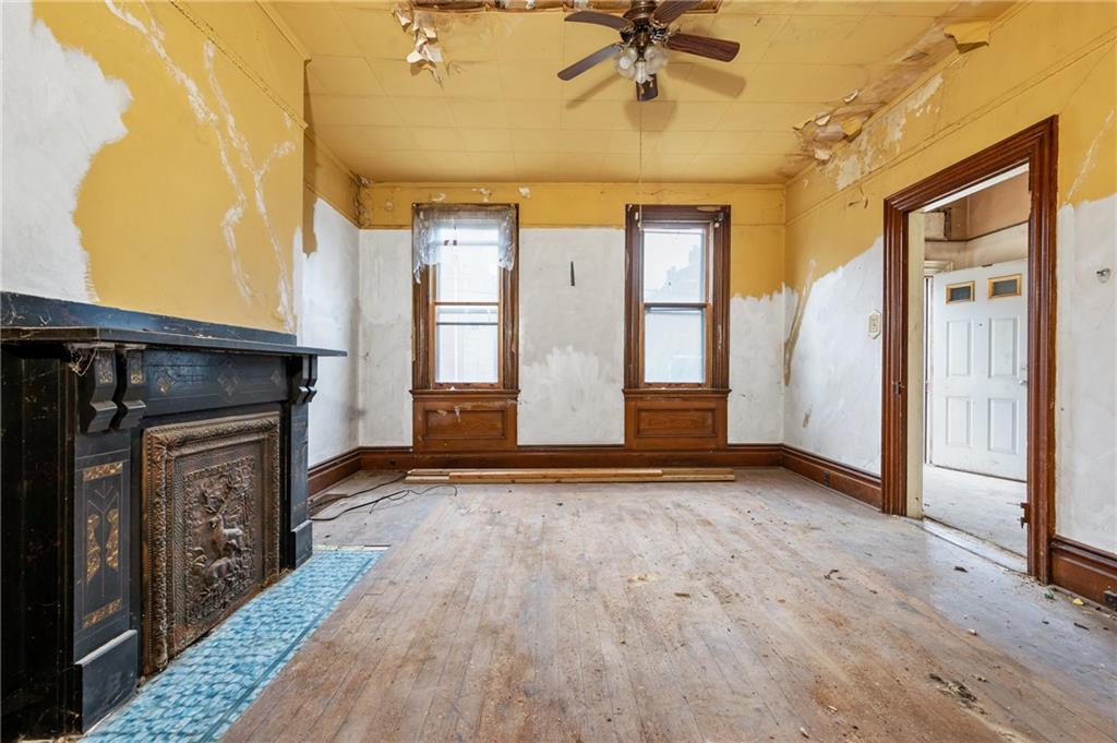1234 High Street Pittsburgh, PA 15212 - Photo 2 of 27 a view of an empty room with a fireplace and a window