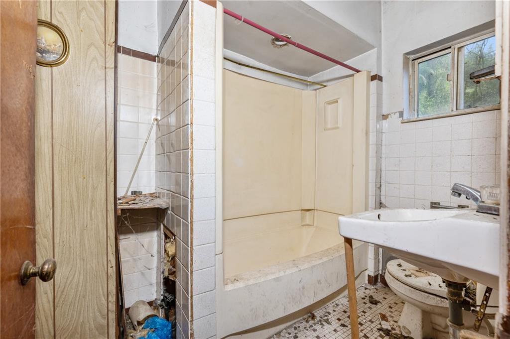 1234 High Street Pittsburgh, PA 15212 - Photo 6 of 27 a bathroom with a bathtub and shower
