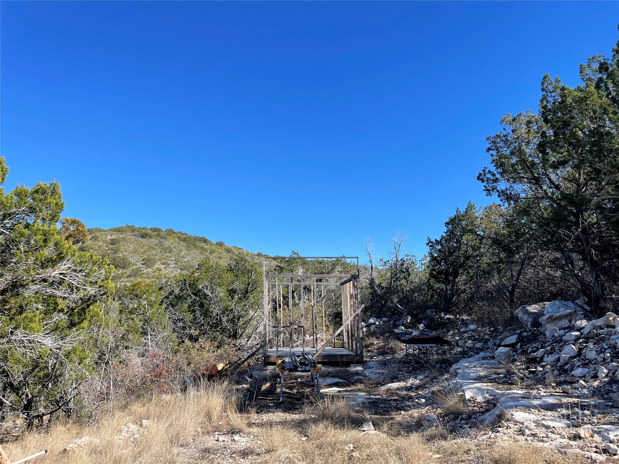305 Walnut Springs Ranch Road Uvalde, TX 78801 - Photo 16 of 21 a view of a mountain range with trees in the background
